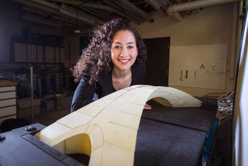 a woman smiling for the camera mit graduate student karly bast shows off a scale model of a bridge d 60575 